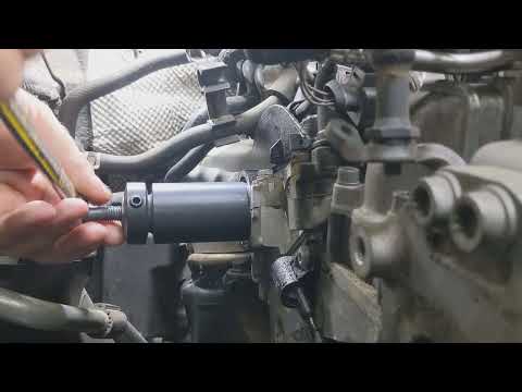 VW Passat TDI CKRA motor cam seal removal using VW tool T10443.