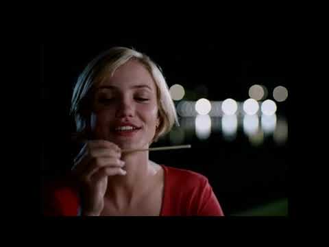 Official trailer frame with Mary and Ted—Miami sunshine and 90s alt-pop attitude