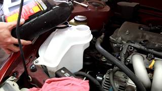 1998-2002 Toyota Corolla washer fluid reservoir remove and replace