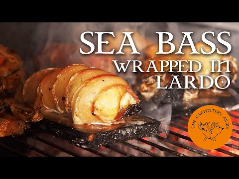 SEA BASS WRAPPED IN LARDO | Cooked on a South African Braai
