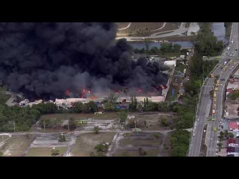 LARGE PLUME OF SMOKE: Chopper video shows massive fire at South Florida warehouse