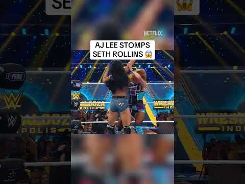 AJ LEE STOMPS SETH ROLLINS 😱