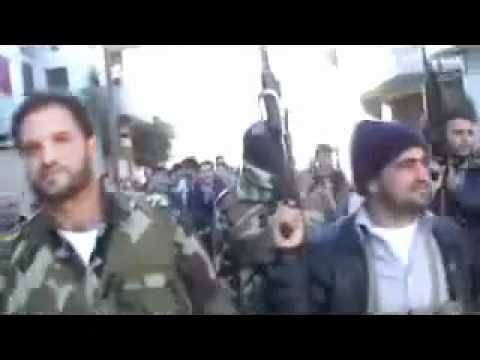 فرحة عناصر الجيش الحر بعد السيطرة على مفرزة الأمن السياسي بمشاركة لواء خالد بن الوليد في مدينة الرستن في حمص