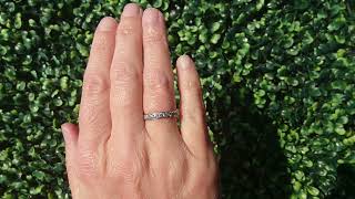 A platinum half hoop diamond eternity ring