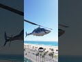 The Bell 222 Helicopter flies by the landing party moments before the crash at Huntington Beach.