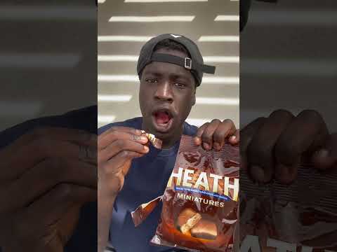 Black man eats Heath chocolate bar for the first time