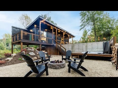 Tiny shipping container house with waterfall