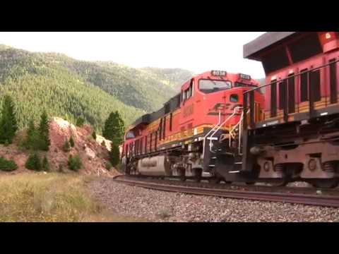 BNSF freight train climbs steep mountain grade through the S curves of the Moffat route.