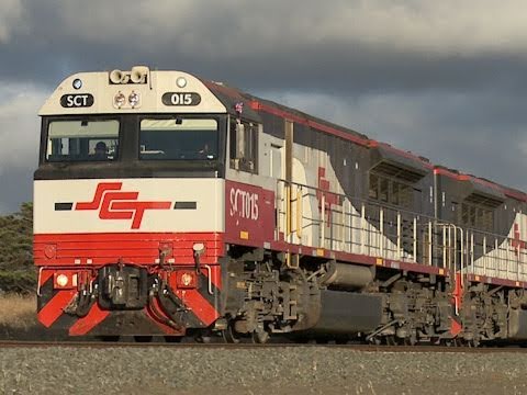 Triple SCT class locomotives leading long Australian freight train - PoathTV