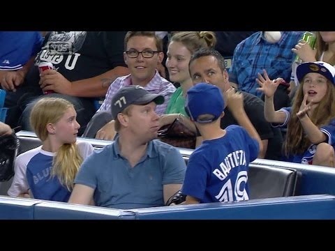 Young fan gives away souvenir ball to girl