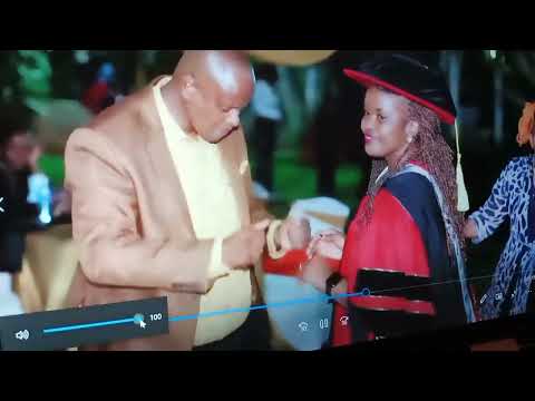 Dr Bubbly Charita Cake cutting on her PhD graduation
