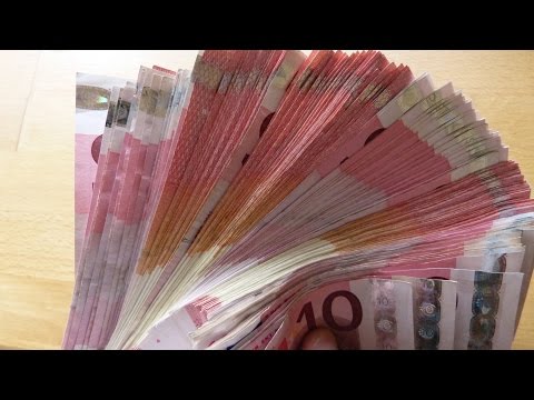 Counting stack of 10 EURO banknotes