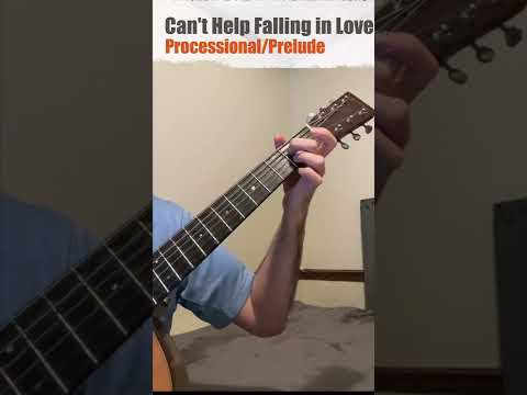left hand of a guy playing acoustic guitar