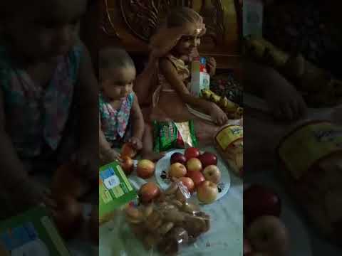 MEHRIN AND HANIFA ARE VERY HAPPY GETTING FRUITS & BISCUITS