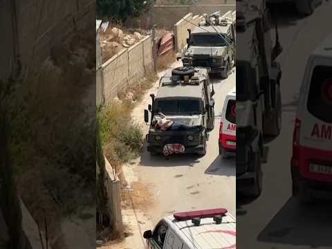 Israeli forces strap wounded Palestinian to jeep