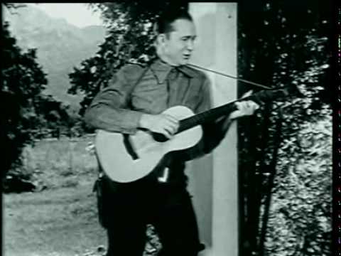 Tex Ritter performs "Rollin' Plains" (Version #02)  in "Rollin' Plains" (1938)