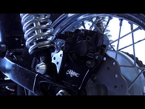 Custom Triumph Bonneville T100, fitting Motone customs brake caliper relocator, disc and pads!
