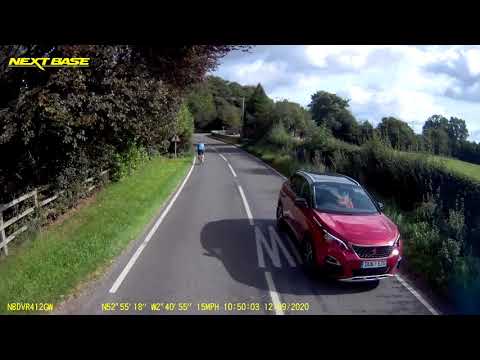 Suicidal Cyclist beckons HGV to overtake with approaching blind bend.