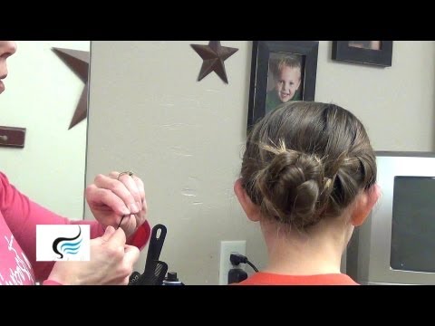 Child with a bow tie messy bun hairstyle, showcasing a playful and neat look, with an instructional focus on easy hair techniques for school and events.
