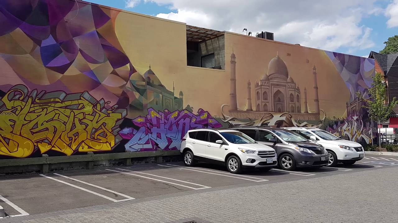 Murals depicting great monuments around the world in East Chinatown