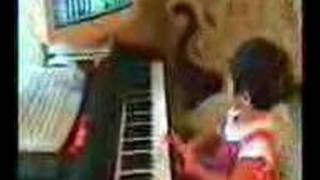 3 year old baby plays piano and reads music