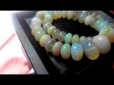 O-3483 Ethiopian Opal 138cts 8-13mm rondelle plain beads 12" strand