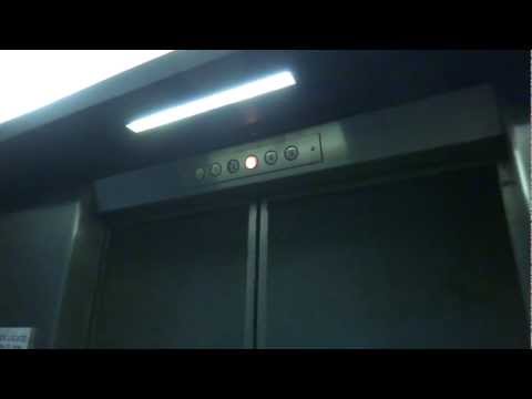 Vintage Otis Traction Elevator at Pius Library with a Mysterious Person