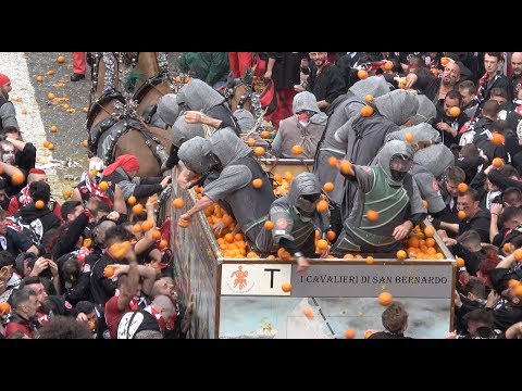 FOOD FIGHT: Thousands gather in Ivrea, Italy to pummel each other with 1.1 million pounds of oranges