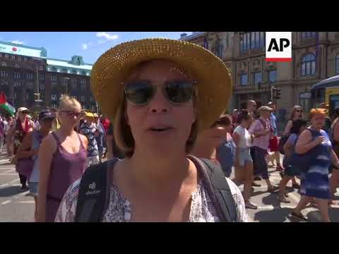 Thousands march through Helsinki to protest Putin-Trump summit