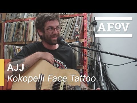 AJJ - Kokopelli Face Tattoo | A Fistful Of Vinyl