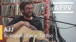 AJJ - Kokopelli Face Tattoo | A Fistful Of Vinyl