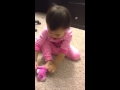 Ella Putting A Sock On