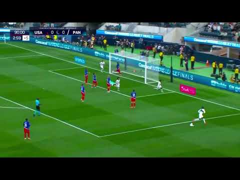 Panama players rush to celebrate with Thierry Henry afterscoring winner against the USA