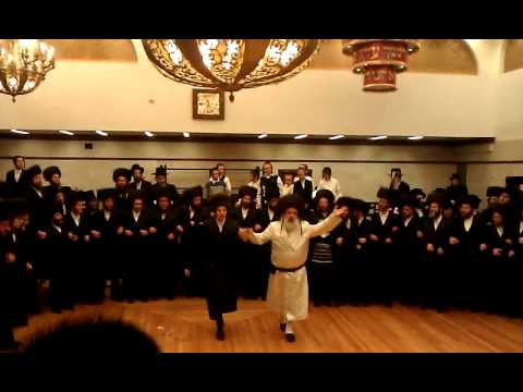 Krula rabbi dancing with both of his sons chasanim