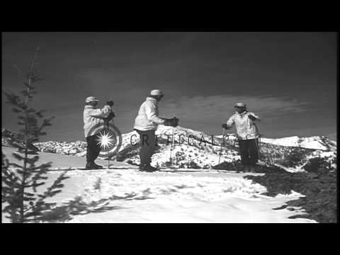 Men climb carrying skies on their shoulders and demonstrate basic movements such ...HD Stock Footage