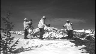 Men climb carrying skies on their shoulders and demonstrate basic movements such ...HD Stock Footage