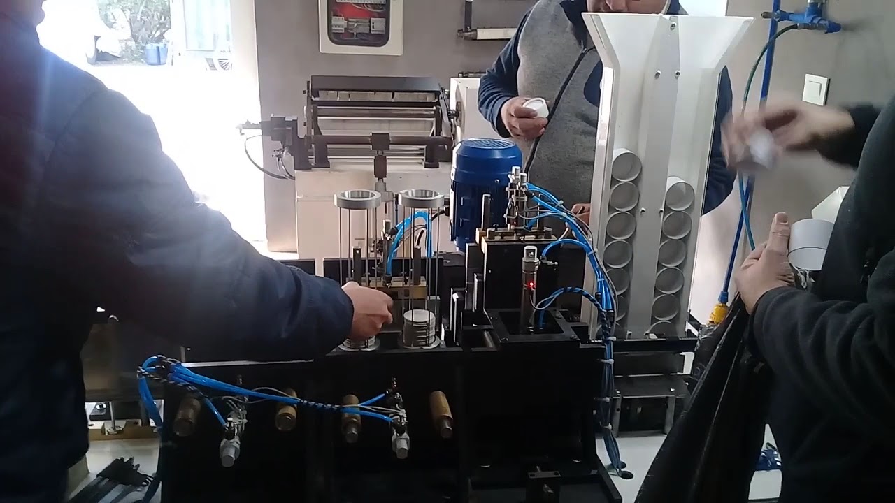 Maquina Armadora Automatica de Tapas con tubos de carton ( AUTOMATIC PAPER TUBE CURLING MACHINE)