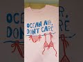 REMERA OVER ESTAMPADA OCEAN AIR, DON'T CARE