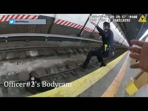 Two NYPD Officers Rescue A Woman From Subway Tracks