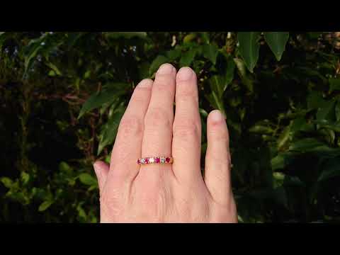 An 18 carat gold ruby and diamond eternity ring