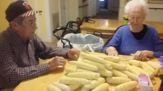 My sweet residents shucking corn... boy I love these residents