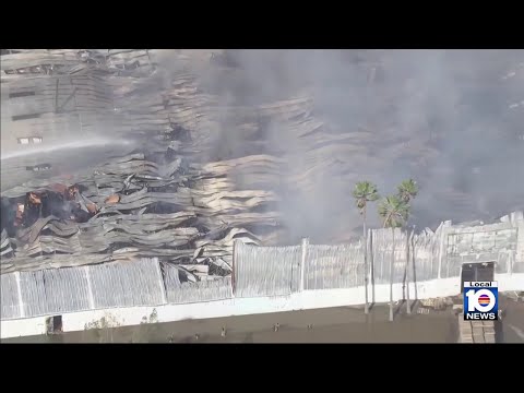 Miami-Dade firefighters still working to extinguish flames at large warehouse