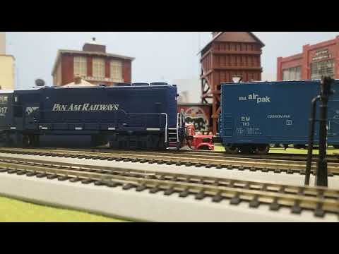 Pan Am MEC 517 scoops up a cut of cars in Domingham