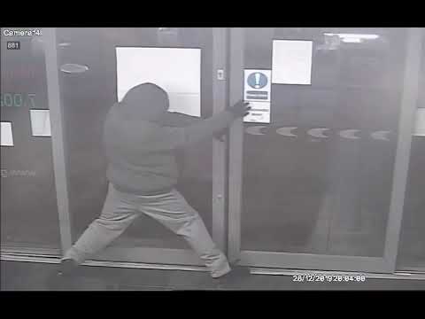 CCTV shows bungling robber who held up shop with snooker cue accidentally trapping himself inside