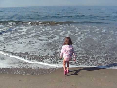Kaylin running in the waves