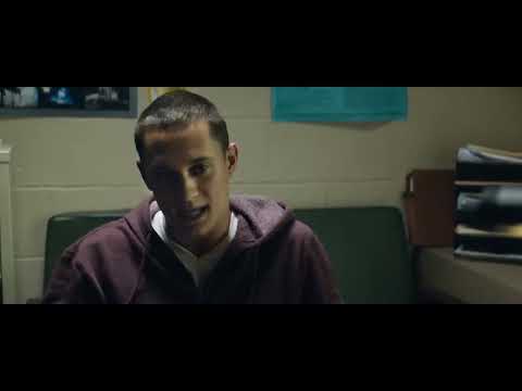 The Land trailer confrontation outside a corner store at night with police lights flaring