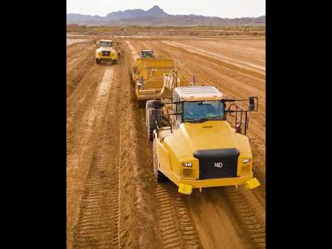 CAT trucks + K-Tec scrapers = a powerful earthmoving combo