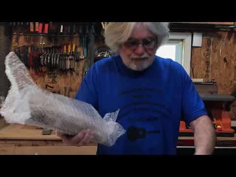 Unpacking a C.F. Martin D-28 guitar kit.