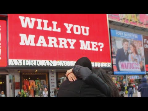 Men Propose on Valentine's Day Using Times Square...