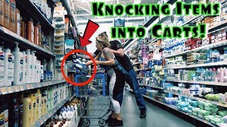 KNOCKING ITEMS INTO STRANGERS SHOPPING CARTS PRANK!!